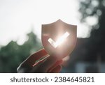 Silhouette of Businessman holding shield protect icon, Security protection and health insurance. The concept of family home, foster care, homeless support, protection, health care day.