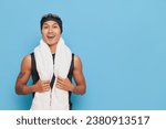 Small photo of Smiling swimmer guy posing after swimming competition with towel on his neck and cap on his head, sport life concept, copy space.