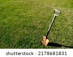 An old weathered spade with a...
