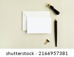 Horizontal card mockup for lettering, greeting card, notecard, invitation design presentation, white envelope, wax seal stamp and calligraphy pen.