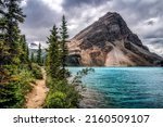 The path by the mountain lake. Beautiful mountain lake view. Lake in mountains. Mountain lake water landscape