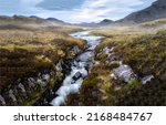A river in a mountain valley. River valley in mountains. River valley landscape. River valley panorama