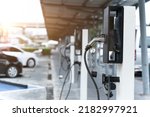 Electric car on electric car charging station. Power supply for electric car charging. Clean energy concept