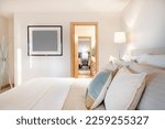 Small photo of large bedrooms with adjoining bathroom jack and jill furnished interior space twin beds queen sized bed red tile and red towels