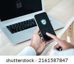 Small photo of Two factor authentication or 2FA concept. Safety shield icon while access on phone with laptop for validate password, Identity verification, cybersecurity with biometrics authentication technology.