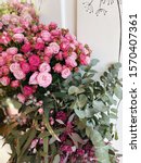 Small photo of Beautiful pink bombastic bunch of roses and eucalyptus, vertical photo