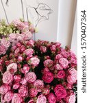 Small photo of Beautiful pink bombastic bunch of roses and eucalyptus, vertical photo
