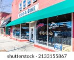 Small photo of GASTONIA, NC, USA-3 MARCH Ride-A-Bike bicycle shop, diagonal front view and entrance.