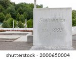 Small photo of Srebrenica, Bosnia and Herzegovina, July 9 2020: Engraved letters of Srebrenica in stone. A reminder of the heinous crimes