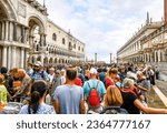 Small photo of Venice, Italy - September 18 2022: The visible effects of overtourism as cruise ship passengers crowd the walkway at the Doge's Palace in Piazza San Marco on a busy day in Venice, Italy