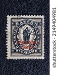 Small photo of Potsdam, Germany APR 20, 2022. Stamp year 1920 of the Deutsche Reichspost, Bavarian definitive stamp series with overprint "Deutsches Reich", 2 12 Mark, Patrona Bavariae (Latin for: Patroness o