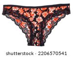 Underwear woman isolated. Close-up of luxurious elegant black lacy thongs panties with colorful orange pattern isolated on a white background. Underwear fashion.