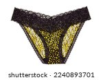 Underwear woman isolated. Close-up of luxurious elegant black lacy thongs panties with colorful yellow stars pattern isolated. Clipping path. Macro. Underwear fashion.