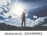 Small photo of Man rise hand up to amazing blue sky feel never give up and freedom.