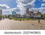 Small photo of Rotterdam, Netherlands - May 27, 2022: A sunny day in the center of Rotterdam. People shop and enjoy themselves on the lawn between Grotemarkt and Hoogstraat.