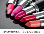Lipstick. Fashion Colorful Lipsticks over black background. Lipstick tints palette, Professional Makeup and Beauty. Beautiful Make-up concept. Lipgloss. Lipsticks closeup