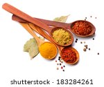 Spices. Spice in Wooden spoon. Herbs. Curry, Saffron, turmeric, cinnamon and other isolated on a white background