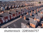 Small photo of An aerial view above the rooftops of run down back to back terraced houses in the North of England