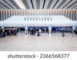 Small photo of TERMINAL 2, MANCHESTER AIRPORT, UK - SEPTEMBER 14, 2023. Air passengers and travellers walking through the new departure lounge at Terminal 2 of Manchester Airport