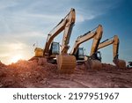 Small photo of A large construction excavator of yellow color on construction site in quarry for quarrying. Industrial image. Excavator with Bucket lift up digging the soil in the construction site on sky background