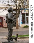 Small photo of Mukachevo, Ukraine - April 6, 2015: Monument of Happy Chimney Sweeper and his cat. The monument with real chimney sweeper Bertalon Tovt by Ukrainian sculptor Ivan Brovdi