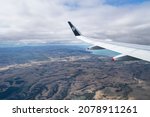 Small photo of Canterbury, New Zealand - April 14 2021: Aerial view of an airplane wing with Air New Zealand logo. Flying above the Canterbury