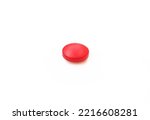 Red tablet pill medication isolated on white background.One single medicine