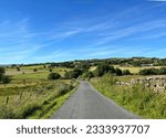 Panoramic view from, Smalden Lane of the Lancashire countryside, with dry stone walls, wild plants, fields and hills,in Grindleton, UK