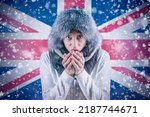 Increase in the price of natural gas for home heating. A citizen of United Kingdom freezes in front of the flag. Energy crisis in Europe. Transition to renewable energy sources.