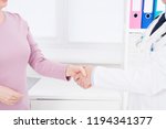 doctor shakes arm his patient... | Shutterstock . vector #1194341377