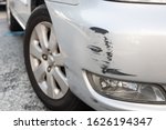 Small photo of Scratch abrasion on car front bumper due to minor accident