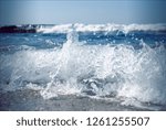 Small photo of A small wave going ashore with foam
