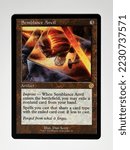 Small photo of Hamburg, Germany - 10302022: photo of the English Magic The Gathering card Semblance Anvil on white paper background.