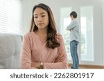 Small photo of Divorce. Asian couples are desperate and disappointed after marriage. Husband and wife are sad, upset and frustrated after quarrels. distrust, love problems, betrayals. family problem, teenage love
