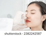 Small photo of plastic surgery, beauty, Surgeon or beautician touching woman face, surgical procedure that involve altering shape of nose, doctor examines patient nose before rhinoplasty, medical assistance, health
