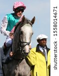 Small photo of DONCASTER RACECOURSE, STH YORKSHIRE, UK : 14 SEPTEMBER 2019 : Frankie Dettori and Logician leave the Parade Ring prior to winning the 2019 running of the St Leger at Doncaster Races