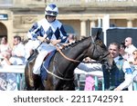 Small photo of DONCASTER RACECOURSE, SOUTH YORKSHIRE, UK : 13 August 2022 : Jockey Cieren Fallon adjusts his reins as he leaves the Parade Ring on his horse at Doncaster Races