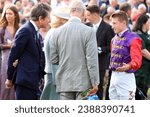 Small photo of DONCASTER RACECOURSE, SOUTH YORKSHIRE, UK : 16 September 2023 : Jockey Tom Marquand meets His Majesty King Charles and Her Majesty Queen Camilla at Doncaster Racecourse on St Leger day
