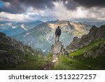 Male Hiker Standing On A Rock...