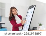 Portrait young businesswoman presentation marketing and profit with confident at office, investment and seminar for planning of finance, business woman standing explaining chart and graph.