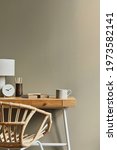 Small photo of Interior design of neutral bohemian living room interior with stylish desk, armchair, lamp, cup of coffee decoration, office supplies, clock, copy space, notes and personal accessories. Template.