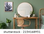 Elegant details of modern interior design with wooden sideboard, bed, mirror, painting and stylish personal accessories. Green wall. Mock up poster. Template.