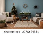 Amazing and cozy christmas living room interior with modular sofa, boucle armchair, wooden consola, candlestick, christmas tree, gifts, decoration and elegant accessories. Family time. Template.