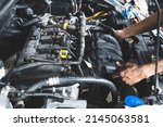 Small photo of Intake manifold replacement in garage service shop.