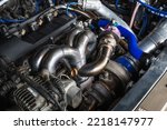 Small photo of Welding fabrication stainless steel turbocharged and wastegate exhaust manifold headers , in turbocharged racing car.