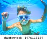 Underwater View Of A Young Boy...