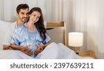 Small photo of Cheerful husband enjoy embracing pregnant wife and happy to tenderly fondle beloved belly of unborn baby and expecting warm family during prenatal care of maternity at romantic bedroom of sweet home.