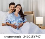 Small photo of Cheerful husband enjoy embracing pregnant wife and happy to tenderly fondle beloved belly of unborn baby and expecting warm family during prenatal care of maternity at romantic bedroom of sweet home.