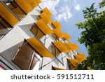 apartment building with happy windows and yellow sun filters
