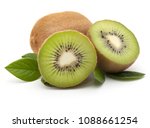 Kiwi fruit whole and sliced, isolated on white background. With green leaves. Close-up.